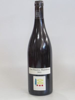 a bottle of wine that is sitting on a table