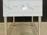 an image of a table with a sign attached to it