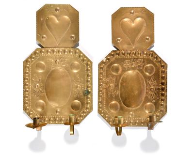 pair of gold plated wall sconces with hearts on them