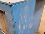a blue cabinet that has a pot on top of it