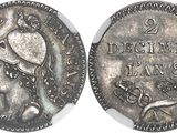 une pièce d'argent sur laquelle figurent la tête d'une femme et un oiseau