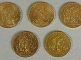 four gold sovereigns, one of which is a sovereign and one of which is a sovereign