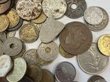a lot of coins that are on the table