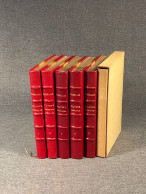 four red books are stacked on top of each other on a gray surface