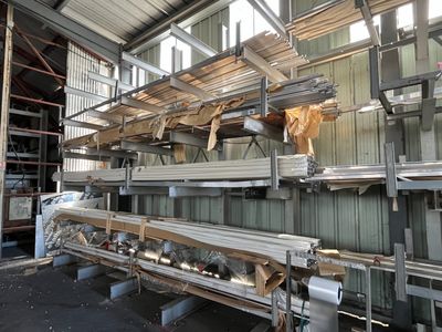 a large amount of steel beams in a warehouse