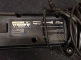 a black power supply that is connected to a charger
