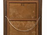 an old wooden frame with a rope hanging from it