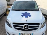 a white car with a blue star on the front of it