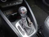 an image of a car ' s gear lever in the center console