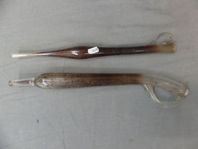 two different types of toothbrushs sitting on a table