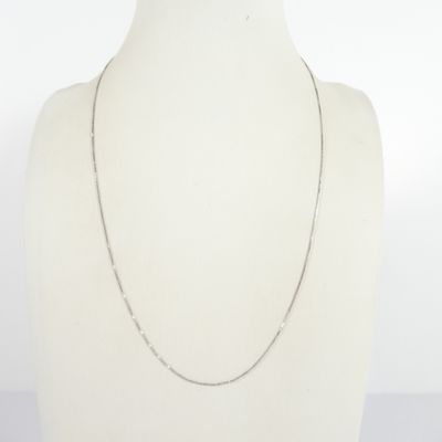 a close up of a mannequin torso with a chain on it