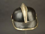 a helmet with a feather on top of it on a stand