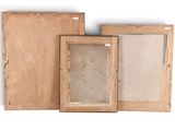 three wooden picture frames are lined up on a white surface