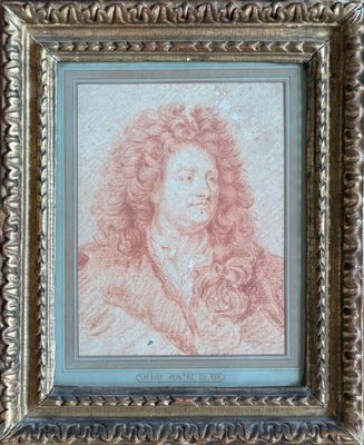 un tableau représentant un homme aux cheveux bouclés, dans un cadre doré