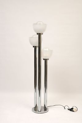 pair of chrome plated floor lamps with frosted glass shades