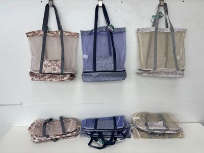 four bags hanging on the wall in the room