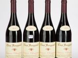 trois bouteilles de vin rouge posées l'une à côté de l'autre sur une surface blanche