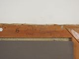a piece of wood with writing on it and a pair of scissors next to it