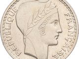 a close up of a coin with a woman ' s head on it