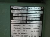 a sign on the side of a machine that says