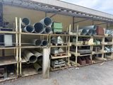 many different types of pipes on the shelves in the warehouse
