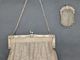 an antique silver mesh purse with chain and clasp