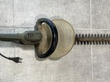 an image of a corded sander on the floor