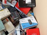 a cardboard box full of electronic devices and other items