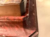 a loaf of bread sitting on top of a red box
