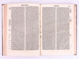 an open book on a white surface with a white background