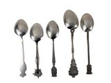 five spoons that are lined up in a row