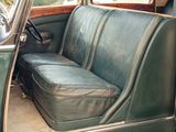 a green seat in the back of a green car
