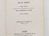 a book open on a white table with a black and white picture