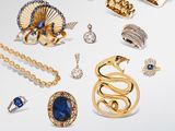 an assortment of gold jewelry including rings, bracelets, rings, and bracelets