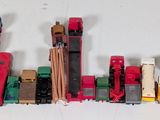 a lot of toy trains that are lined up on the table