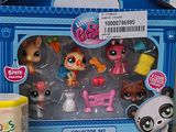 a box of littlest pet shop toys on a table