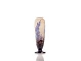 a vase that is sitting on a stand on a white surface