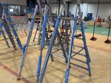 many ladders that are sitting in the middle of a room