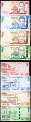 four different bills of different colors and shapes on a black background