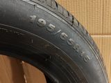 a close up of a tire on a cardboard box with a cardboard box in the background