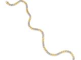 a gold and silver necklace with a snake on a white background