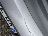 a close up of a car tire with a sticker on it