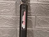 an image of a close up of a tool on a brick wall