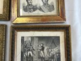 four framed pictures of men and women are on a table