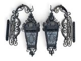 two old fashioned street lights on the wall next to each other