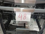 a dishwasher that has a lot of dishes in it