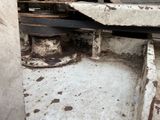 a rusted old truck with a rusted wheel on it