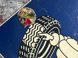 a blue sign with a picture of a cartoon character holding a tire