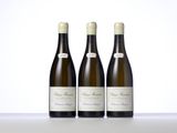 three bottles of wine sitting on top of a table next to each other