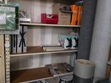 a room with a shelf and a lot of supplies